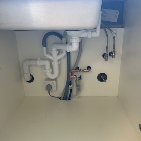 Plumbing repairs under sink piping repair and installation
