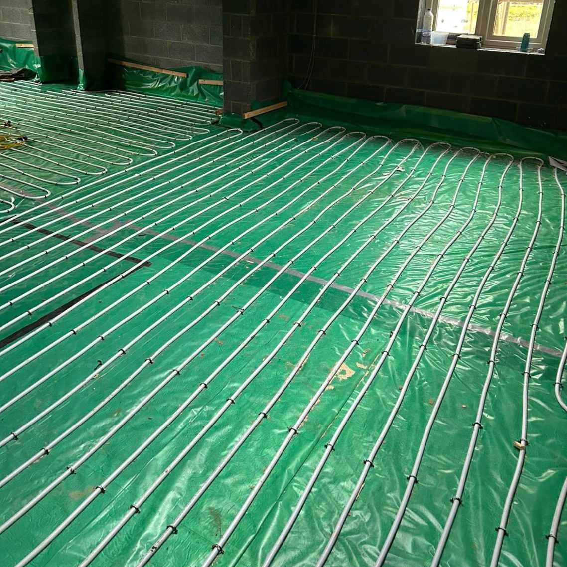 Under floor heating Underfloor heating pipe work laid out neatly